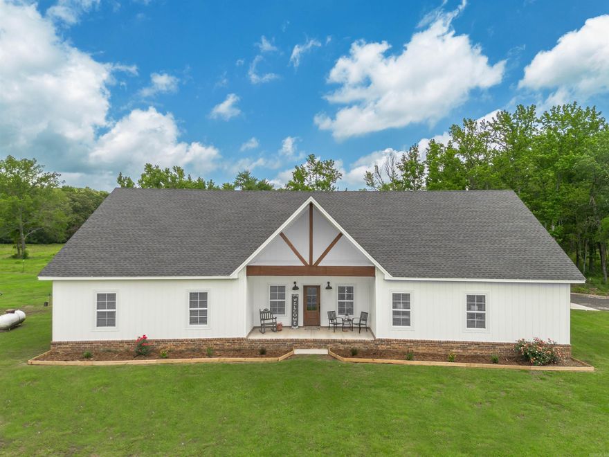 HOME, SHOP, and TEN ACRES....OH MY! This home features three bedrooms(could easily have 4) and three bathrooms, along with a small office, heated and cooled storage/hobby room accessed from the garage, and a versatile game room that can either be enclosed or opened to the covered back porch. The back porch is not only ideal for relaxation but also includes an outdoor shower for added convenience. Additionally, the property has a spacious 40x50 shop equipped with both 110 and 120 power, complete with a half bath. Additional acreage is available, up to 25 +/-  total.