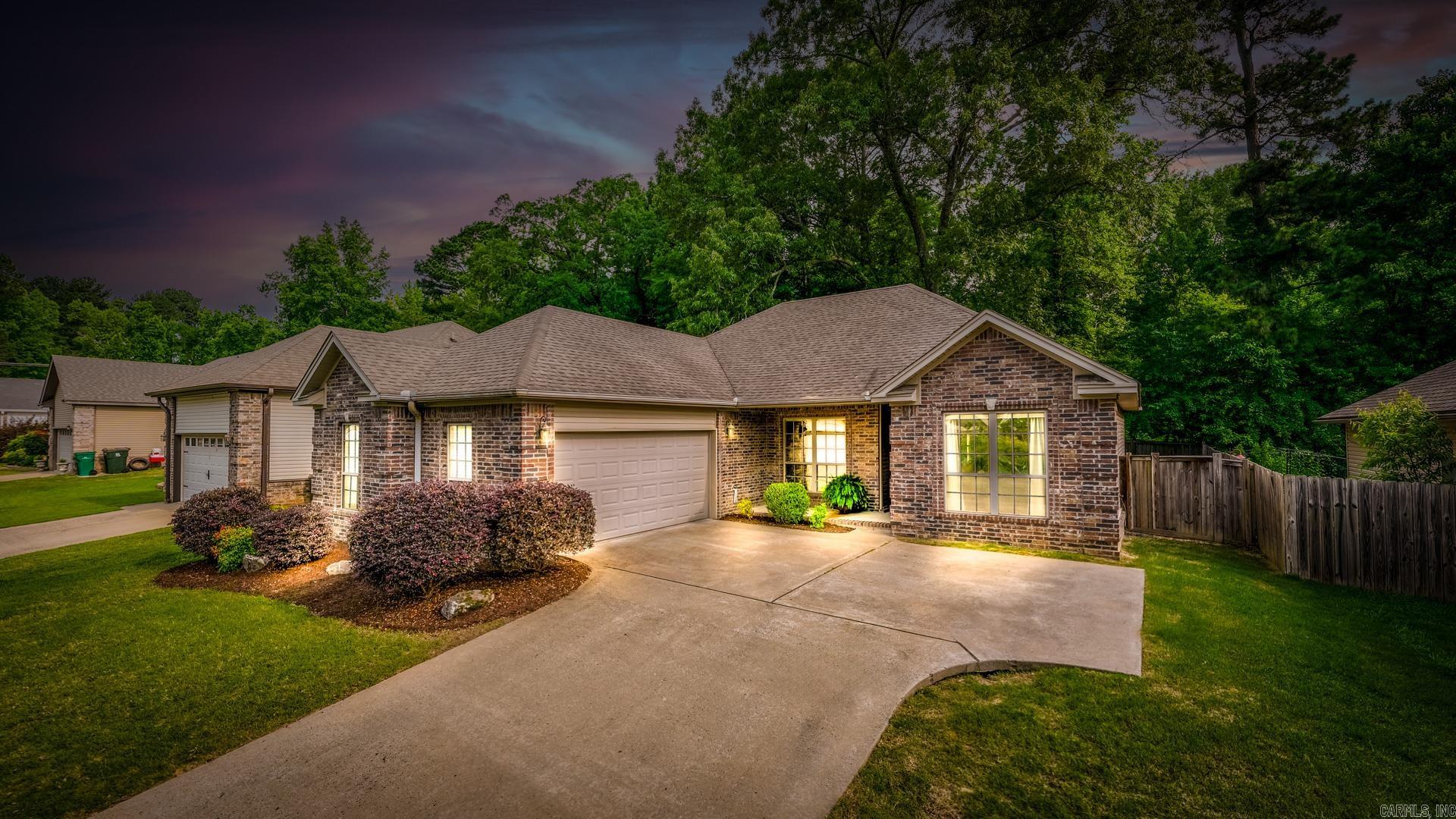Welcome to this charming 3-bedroom, 2-bathroom home that perfectly blends comfort, style, and functionality. From the moment you arrive, you’ll appreciate the inviting curb appeal and the unique courtyard-entry garage that offers both privacy and a touch of elegance. Inside, the open-concept layout creates a warm and welcoming atmosphere, ideal for both daily living and entertaining. The spacious living area flows seamlessly into the dining space and kitchen, where you’ll find ample cabinetry, modern appliances, and plenty of natural light. The primary suite features a generous walk-in closet and a private en-suite bath, while the two additional bedrooms offer flexibility for guests, a home office, or a growing family. Step outside to enjoy a fully fenced backyard—perfect for pets, play, or peaceful evenings under the stars. Whether you’re hosting a barbecue or simply relaxing, this outdoor space is ready for it all. Located in a desirable neighborhood with easy access to local amenities, this home is the total package. Don’t miss your chance to make it yours!
