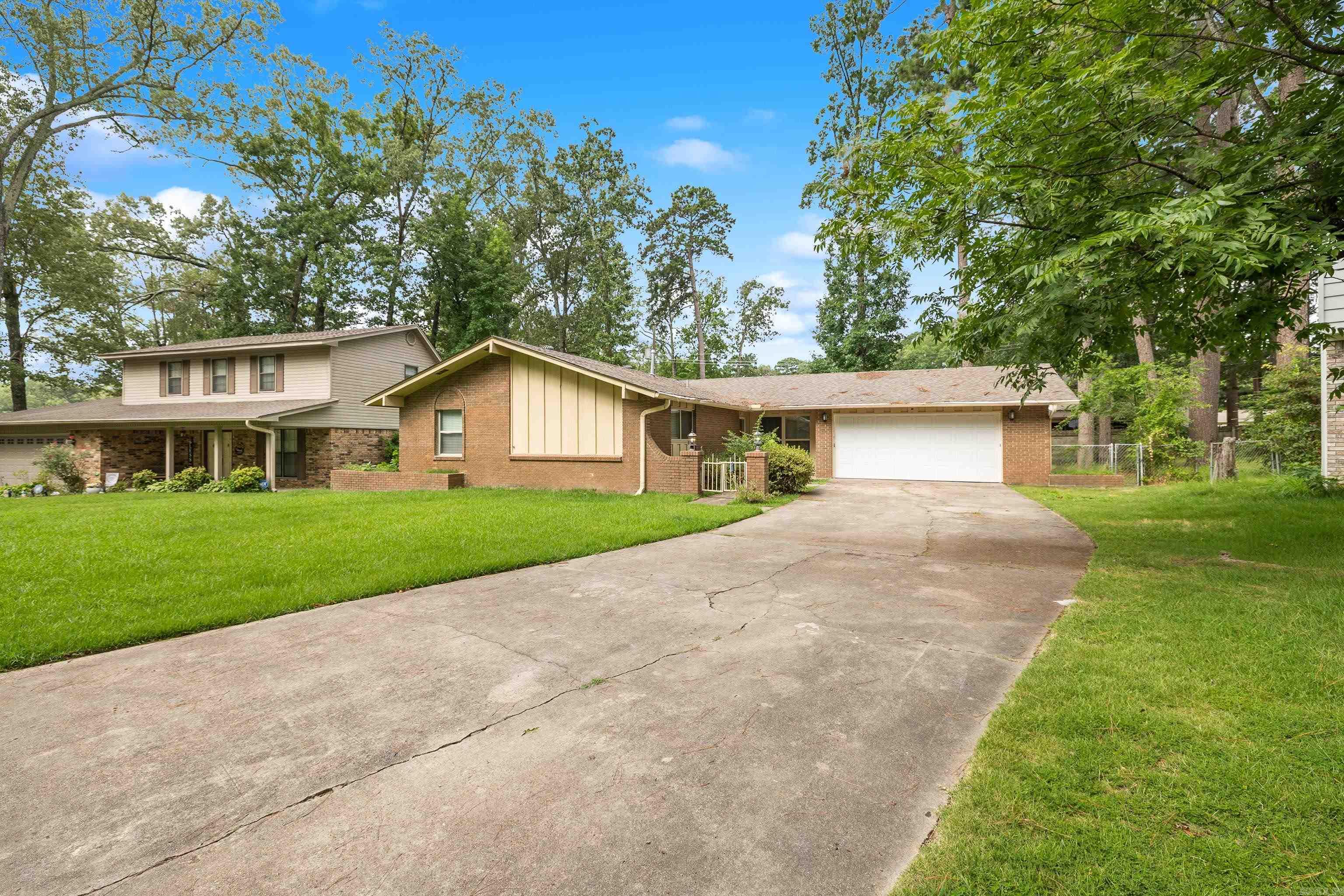 Welcome to your beautifully updated 3-bedroom, 2-bath home offering comfort, style, and smart upgrades throughout. With a newer roof (2021) and fresh flooring, this move-in-ready gem blends modern living with timeless charm. Enjoy multiple living areas including a cozy front room and a spacious den featuring a brick fireplace—perfect for relaxing or entertaining. The kitchen and bathrooms have been tastefully updated with stylish finishes and practical design. Smart touches like Bluetooth-enabled retractable ceiling fans with remote controls add a tech-savvy flair to the space. Step outside to a fully fenced backyard—ideal for pets, gatherings, or enjoying a private outdoor escape. Whether you're starting fresh, upsizing, or settling into your next chapter, this home offers the ideal balance of updates, functionality, and warmth. Schedule your private showing today and experience all this inviting home has to offers