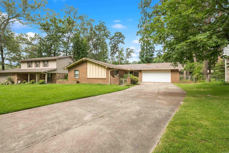 Welcome to your beautifully updated 3-bedroom, 2-bath home offering comfort, style, and smart upgrades throughout. With a newer roof (2021) and fresh flooring, this move-in-ready gem blends modern living with timeless charm.  Enjoy multiple living areas including a cozy front room and a spacious den featuring a brick fireplace—perfect for relaxing or entertaining. The kitchen and bathrooms have been tastefully updated with stylish finishes and practical design.  Smart touches like Bluetooth-enabled retractable ceiling fans with remote controls add a tech-savvy flair to the space.  Step outside to a fully fenced backyard—ideal for pets, gatherings, or enjoying a private outdoor escape.  Whether you're starting fresh, upsizing, or settling into your next chapter, this home offers the ideal balance of updates, functionality, and warmth.  Schedule your private showing today and experience all this inviting home has to offers