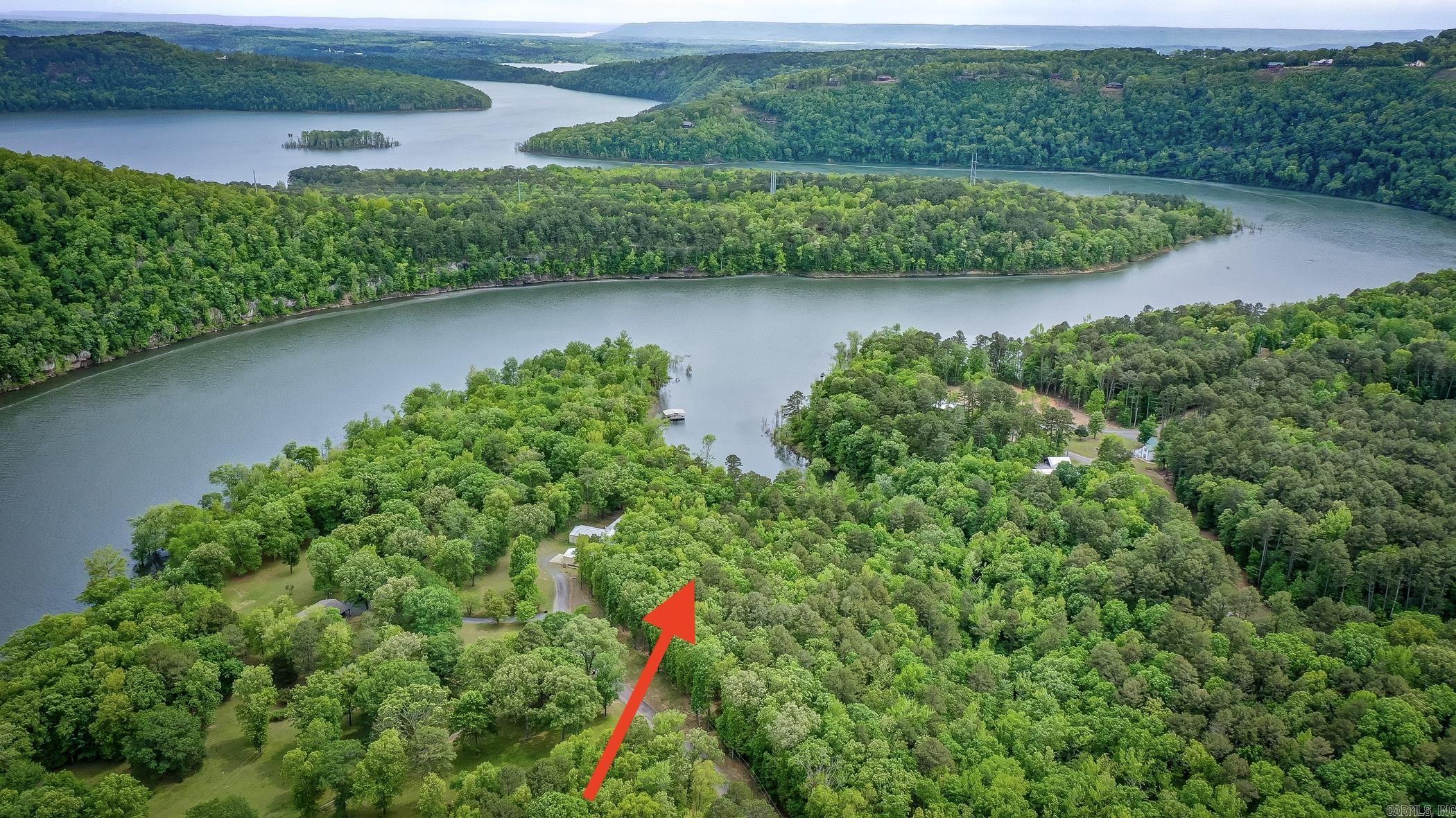 Lakefront Tracts combined with road frontage tract located towards the end of Mayhand Rd. Owned by multiple different family members since the 1980's & 1990's that totals approximately 2.19 acres. The property touches the corp. of engineers & is located in a cove off of the Middle Fork section of Greers Ferry Lake. Leech Road Public boat ramp is less than a mile away, so short ride to launch your boat or jetskis. do not have any restrictions, except sellers retaining any mineral rights. City Water along Mayhand Road and First Electric power at the road as well.