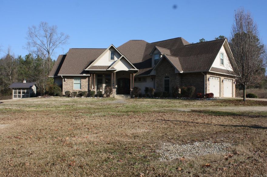 CUSTOM BUILT HOME (listed $75,000 below appraisal) offers approx. 3930 Sq. Ft. of living space.  Home has 4 bedrooms on main level and 1 bedroom on second level.  Kitchen features propane gas stove, built in double wall ovens, large island with seating space, granite counter tops and lots cabinet space.  Formal dining area.  Family area features a brick fireplace (propane gas).  Home has hardwood flooring thru out and wide crown molding thru out.  Large master bath has travertine flooring, claw foot tub, built in vanity, lots of storage, double sinks with granite counter tops.  Large separate office with built ins.  Large laundry area also has granite counter tops and sink.  Covered patio and a 16x32 inground pool with waterfall. Home has a 85 gal. water heater. 3 car attached garage.  36x36 shop with a 12x36 loft with full bath and its own septic system.  Large greenhouse.  Refrigerator conveys with sell of home.  NEED 24 HR NOTICE TO SHOW