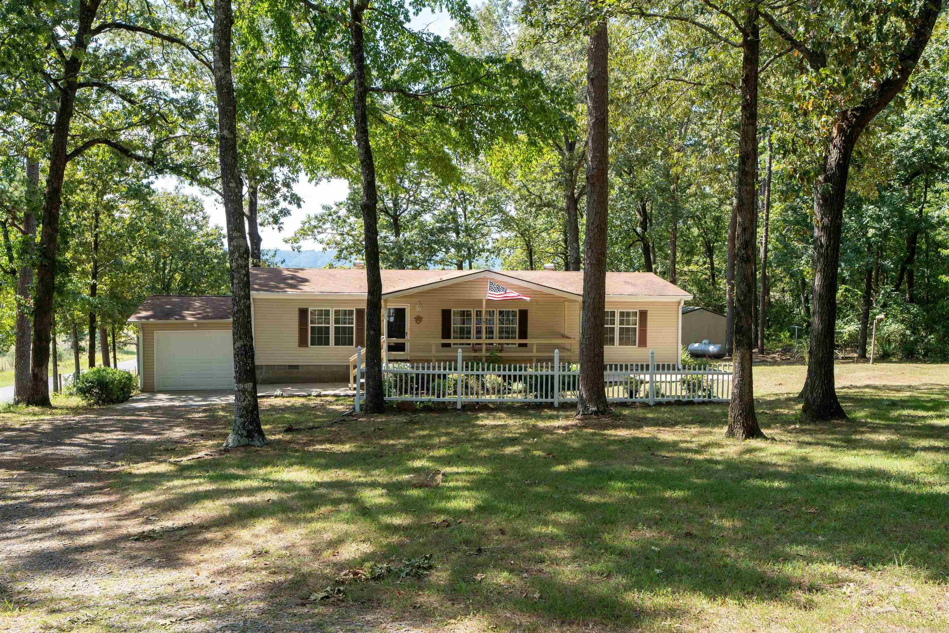 Located minutes from COW SHOALS walk-in access on the Little Red River, this comfy 3 BR, 2 BA 1456 sf double wide Manufactured Home with attached garage is well suited for full or part time living. 8 x 20 metal shop plus 2 storage buildings. New dishwasher 2025, HVAC 202,. Seller has Permanent Foundation Engineering Certificate and the Cancelled Title. See attached documents