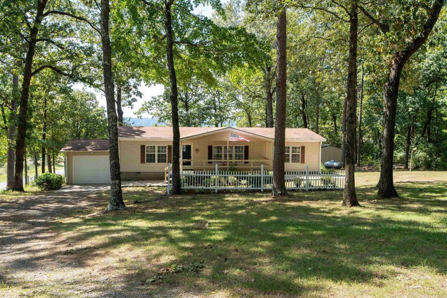 Located minutes from COW SHOALS walk-in access on the Little Red River, this comfy 3  BR, 2 BA  1456 sf double wide Manufactured Home with attached garage is well suited for full or part time living.  8 x 20 metal shop plus 2 storage buildings. New dishwasher 2025, HVAC 202,. Seller has Permanent Foundation Engineering Certificate and the Cancelled Title.  See attached documents and showing remarks.