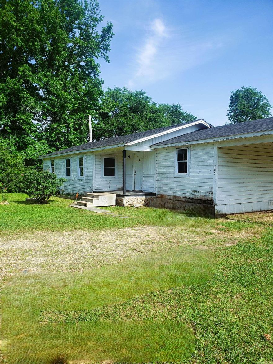 Great country location on paved county road about a mile from Nashville AR Schools!! Home has new roof, newer double pane windows that fold down to clean.  Super green space of a back and front yard!! This is a nice project place in need of some TLC. Home has some nice size rooms split floor plan with cute farmhouse kitchen. Being sold in as is condition.