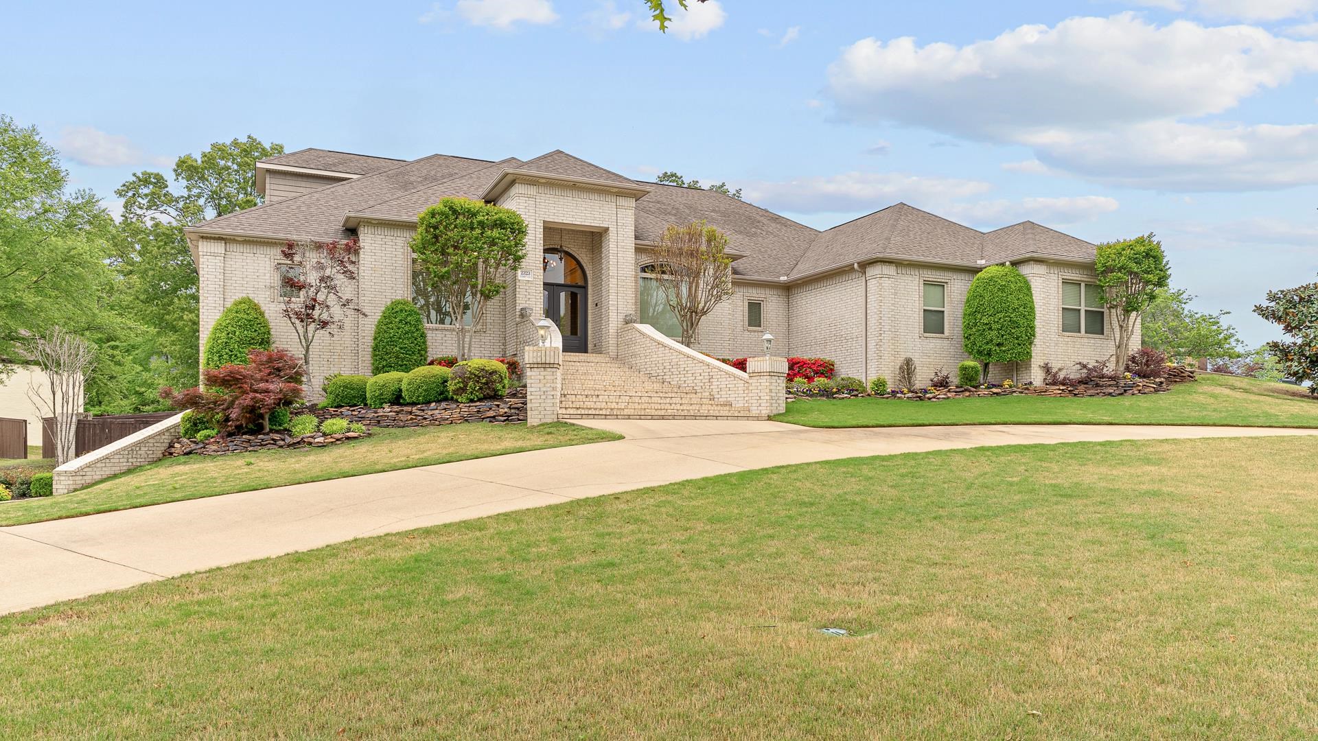 Welcome to the epitome of luxury living in the prestigious Plantation Estates. With 7 bedrooms, 5 full baths, & 2 half baths, this home offers an abundance of space for both relaxation and entertainment. Two primary suites are located on the main level (one is handicapped accessible). The kitchen is a culinary masterpiece, featuring a 5-burner gas cooktop, raised dishwasher, ice maker, wine rack, double ovens, and pantry. Venture upstairs to discover 3 more bedrooms and 2 baths. Descend into the spectacular basement, where entertainment knows no bounds. A full kitchen sets the stage for culinary delights, while the billiard/recreation room provides endless hours of enjoyment. A large hunting/storage closet is conveniently located just off the basement shop/garage. The shop is an additional 470 sq. ft of heated & cooled space. Retreat to the spacious patio room, complete with a full wet bar & grilling porch, ideal for hosting parties or family time. Additional amenities include a 2-car garage, golf cart garage, dog washing station, and dog run. Located just a golf cart ride away from the esteemed RidgePointe Country Club, this home offers a lifestyle of luxury just waiting for you!