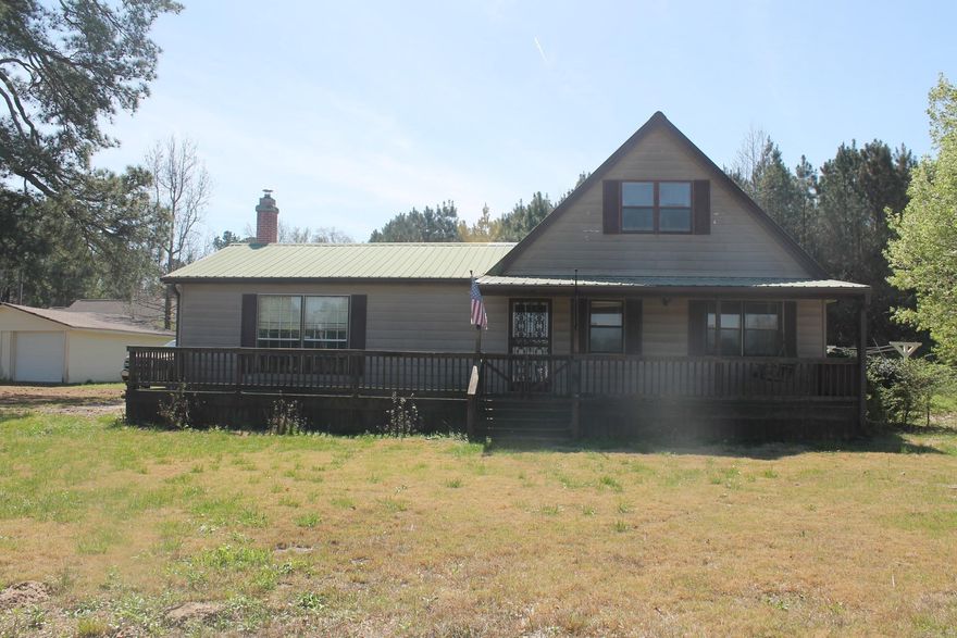 Nice country home with 3.32 acres. Nice front porch with screened in patio. Upstairs with room and a loft. Big living area. Walk in storm shelter. Green house and garden in back yard. Give me a call to see this one today.