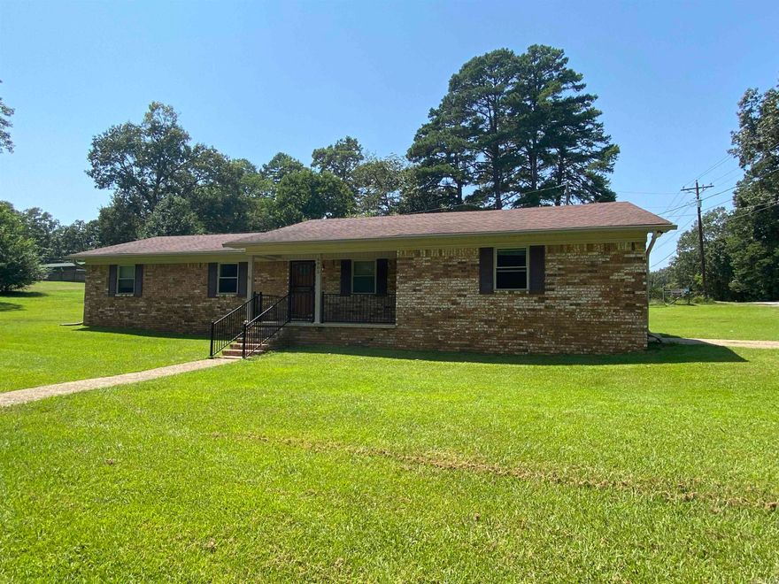 All brick, one level home on over a 1/2 acre lot  just minutes from town on a country setting. Newer windows, blinds, hot water tank (2022), stainless steel dishwasher, some new flooring and paint, plus interior lighting. Very large kitchen is open to the Family/Living room anchored by a rock fireplace and built-ins. Large, covered front porch, side load garage and wired for security. Great location, easy to show. *Agents please see Confidential remarks before submitting offers.