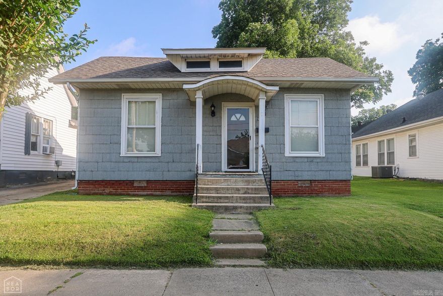 This historic charmer is ready for new owners. Inside you'll be greeted by a semi open floor plan, original refinished wood floors, tall ceilings and abundant natural light. So many unique features have remained untouched such as original built-ins, glass door knobs, and solid wood doors. The large den is ideal for an additional living room, a playroom, or even a third bedroom. Outside, you'll find a shaded yard completely fenced and a storage building. Call to schedule your showing!