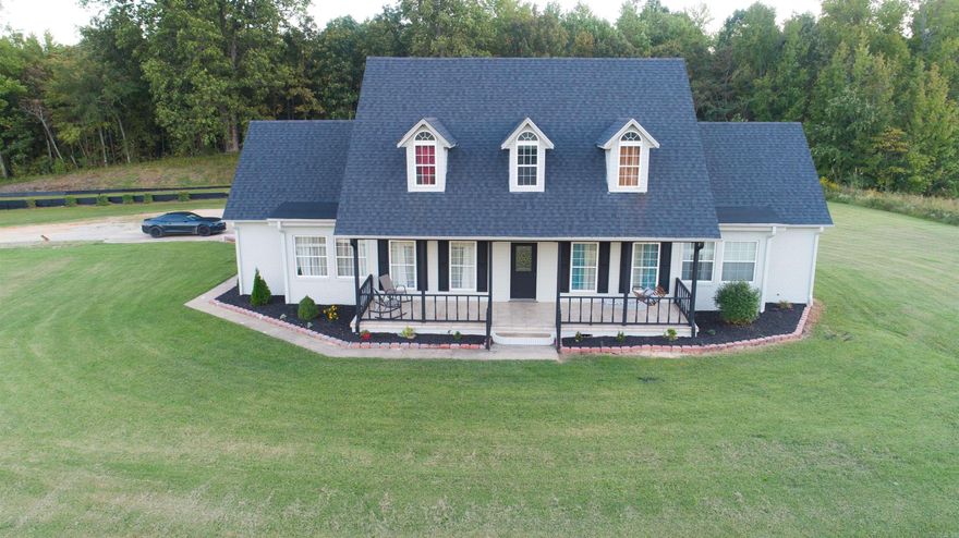 Check out this stunning, one of a kind property! Sitting on approximately 6 acres and boasting four spacious bedrooms, 3.5 bathrooms, and multiple laundry room areas, this is the perfect family home. Out front there is an ideal sized porch to sit on and enjoy the view while having your morning coffee. Upon entering, you’re met with a mixture of modern and elegant style. Fresh paint through the inside and out, new flooring as well, and updated windows. The roof was replaced in 2023. Fully remodeled basement including a bathroom, bedroom, and extra space for a workout area, office, game room, or whatever you desire! The master bedroom is extremely roomy giving you plenty of space for a makeup vanity, office area, etc. New porcelain tile throughout the master bathroom, as well as a walk in shower and a bathtub!  The wood burning fireplace in the living room will keep you extra warm in the cold months coming up. Off the kitchen there is a walk in pantry with plenty of storage, and a dining room for family dinner! All appliances will stay.