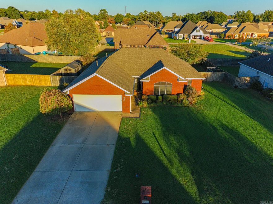 This all-brick home is located on a quiet cul-de-sac and features a fenced backyard, a covered back porch, deck, and a storage shed. The front yard is appealing with landscaping and yard irrigation. Inside, you'll find a spacious kitchen with stainless steel appliances, a large living room with a cozy gas fireplace, and a laundry area with washer and dryer included. The master suite offers a walk-in closet, jetted tub, and walk-in shower for added comfort. Recent updates include a new roof in 2018 and a new water heater in 2019. With plenty of space and thoughtful features throughout, this home is truly move-in ready!