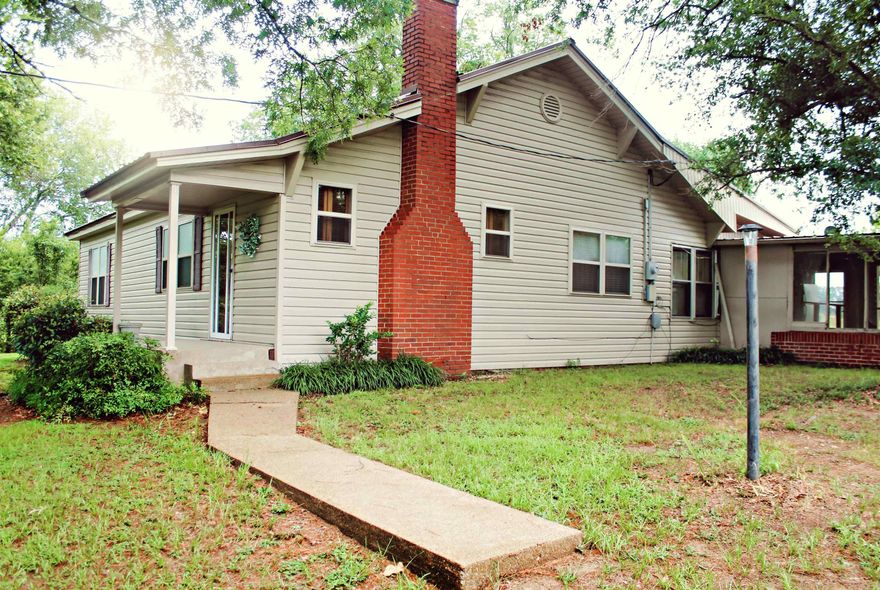 Escape to the serene countryside and embrace the simple joys of rural living in this charming farm house. Boasting 2 bedrooms, 1 bath, and a versatile bonus room that can easily transform into a third bedroom.  Situated on the expansive property are essential outbuildings,  A 10x20 utility building, a generous 24x36 pole shed, and a spacious 30x44 general purpose barn.  A picturesque pond adds a touch of serenity to the landscape, while mature pear and peach trees offer a bounty of fresh fruits to enjoy. The property is further adorned with pecan, black walnut, and buckeye trees, along with scuppernong vines.  Notably, a space where a previous mobile home once stood offers an opportunity for future expansion.  Don't miss the chance to make this charming farm house your own and embrace the peaceful allure of country living. Hurry to call this home today and start creating your own cherished memories in this idyllic countryside retreat.  Schedule a viewing now and step into the tranquility and beauty of rural living!