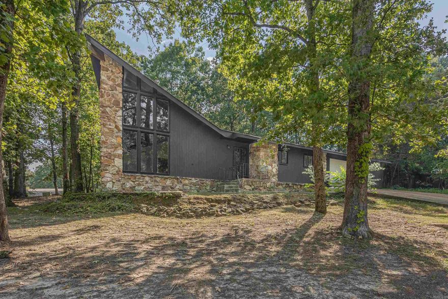 Welcome to 2917 Turtle Creek, a remarkable mid-century home nestled in the heart of a well-established neighborhood. This charming residence offers a unique blend of classic design and modern amenities, making it a true gem in the real estate market. As you step inside, you'll be greeted by the warmth of luxury vinyl plank (LVP) flooring that not only enhances the aesthetics of the home but also provides durability and ease of maintenance. The open-concept living spaces are flooded with natural light, creating an inviting and cheerful atmosphere throughout the day. One of the standout features of this home is the stunning full-height backsplash in the kitchen, which perfectly complements the white panda marble countertops. This combination of materials exudes elegance and sophistication, making meal preparation a true pleasure. The vaulted wood ceilings in the living areas add a touch of rustic charm, creating a cozy ambiance that you'll love coming home to. The master bathroom is a true retreat within the home, boasting a spacious layout and luxurious amenities. Here, you'll find a large soaker tub that beckons you to unwind and relax after a long day.