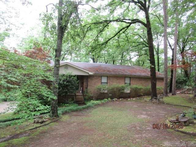 WHAT A BUY....WHAT A BUY!  SELLER SAYS TO SELL!  This 2018 sq. ft. home nestled on .99 acres with picture windows overlooking a private backyard can be yours for the asking!  The architectural roof was installed in September 2024, luxury vinyl floors installed in the living area in 2022, new kitchen appliances installed in 2020, there is a two year old generator that runs the entire home, sprinkler in front yard  and the home has much more to offer! This property is being sold 'as is'. The master bathroom subfloor needs to be replaced and the hall ceiling has some water damage done before the roof was replaced.  Call today to take a look!  You'll be glad you did. Taxes do not include the homestead credit.