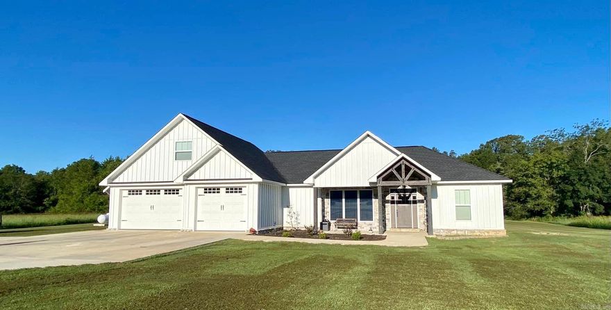 Very well-maintained home that was built in 2021. 3 bedrooms and 2 baths on the main floor with 1 bedroom/office and 1 half bath upstairs in the bonus room. Main bedroom has a large private bathroom with walk in shower, jacuzzi tub and separate vanites. Concrete floors throughout with a spacious utility room off the Main Bedroom. Home has open kitchen, living room and dining with a beautiful Stone Fireplace in the living room. Stunning cathedral dark wood ceilings in the main living area of the home. Deck off the kitchen to the large backyard. 1300sf shop on a slab with garage door and side door that is located at the backside of the property with 500sf being heated and cooled with a mini split.