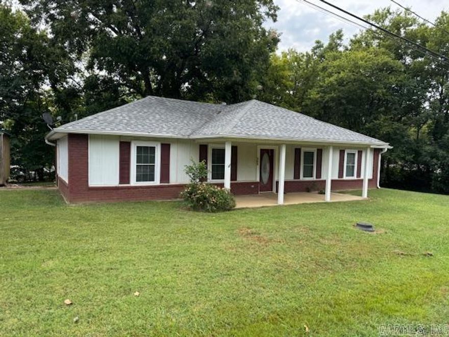 2BR, 1BA HOME IN TOWN!! This 1272 square foot home has just been completely replumbed with pex lines in 2024 along with new central heat and air in 2024! Living room, kitchen and dining room combo. Kitchen comes with stove and pantry. Home is wheelchair accessible with a handicap shower and no stairs/steps into the home. Large bathroom. Metal siding and shingle roof. Two car carport cover, 12X16 storage building. City utilities, corner .26 acre lot. Taxes just $202 after homestead credit!