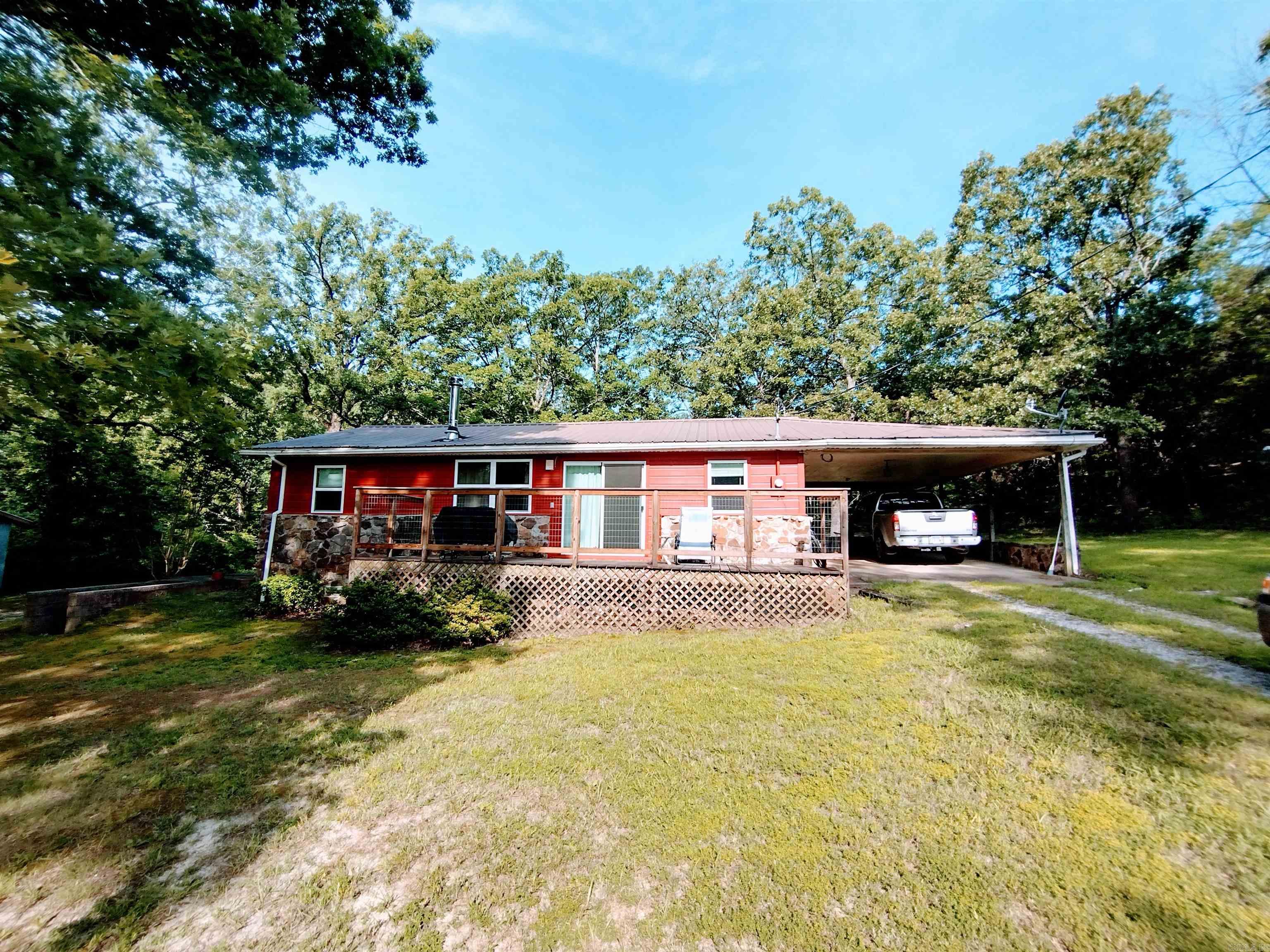 This residence presents a hunter's paradise, adjacent to Ozark National Forest, merely 5 miles to the White River, and mostly wooded, complete with shop. Originally three-bedroom home 2 rooms had closets removed and the home does need some repair.