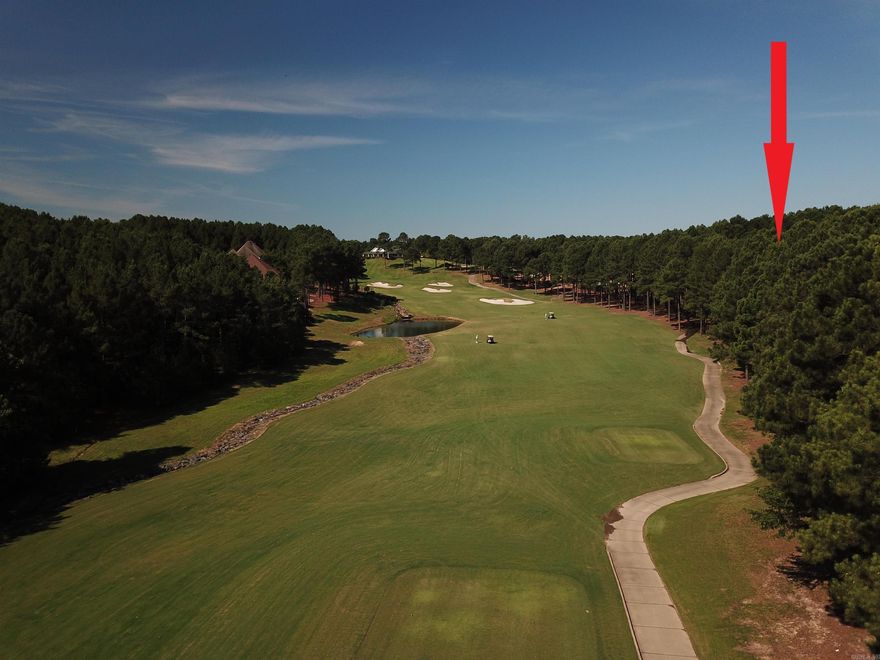 Experience the ultimate in golf living at this breathtaking .59 acre golf lot located on the 18th hole of Granada Golf Course.  Enjoy panoramic views of the lush fairways and cascading water fall from the comfort of your own property.  Nestled in a private, gated community, this is the perfect setting for golf enthusiasts and those seeking a serene, tranquil environment.  Don't miss this opportunity to own one of the few premium golf lots available in the Village.  Home site is conveniently located near the driving range and the full service clubhouse.   Granada Golf Course is ranked as one of the top ten courses in Arkansas.  HSV is a gated community with 9 golf courses; 11 lakes; 20+ miles of trails; fitness center with indoor pool; tennis/ pickleball complex; and more.  Come see what all the Village lifestyle has to offer!  Pictures are photos of the lot and various photos of Granada and Village amenities.