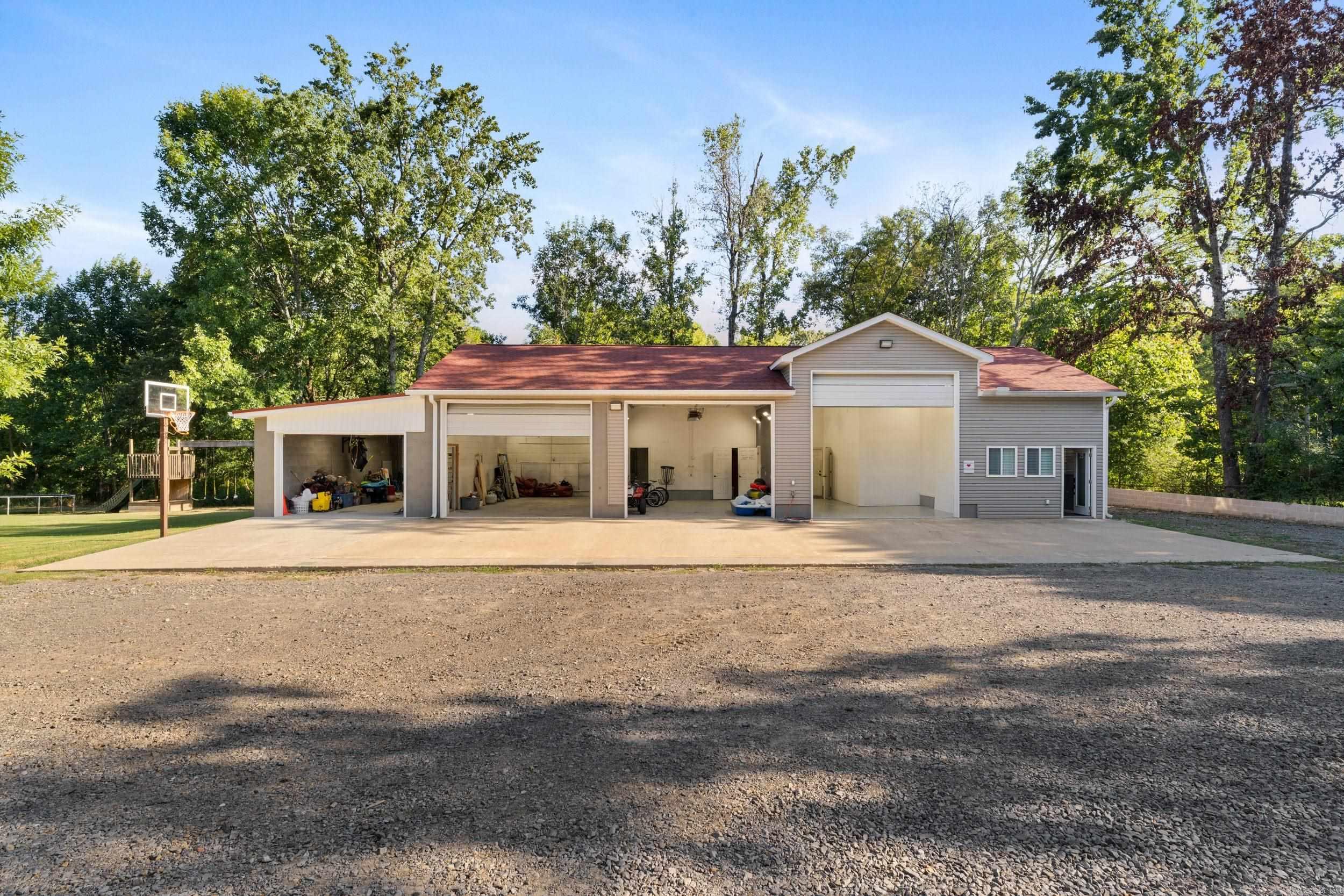 https://view.spiro.media/23_gapview_rd-7944 (COPY& PASTE LINK into browser FOR MORE DETAILED PICS AND VIDEOS ) The shop is located behind home at 23 Gapview in Northeast Conway just outside city limits A RARE property with unlimited possibilities. the, shop area is 2000sq ft with an additional 800 sqft apt or office w 3/4 bath. The home is 2920 Sq ftTOTAL SQ FT IS 5,720. The property also has a FULL RV HOOKUP The shop and home have seperate Utilities and septics for more detailed information about shops, see attached doc(need to ask realtor to provide if you are not a realtor) If you don't need the shops or apartment for your family, the bays and apt would make excellent rental income. PROPERTY WILL ALSO BE LISTED AS A RESIDENTIAL LISTING HOME INFO: SEE 23 GAPVIEW OR MLS#25034958