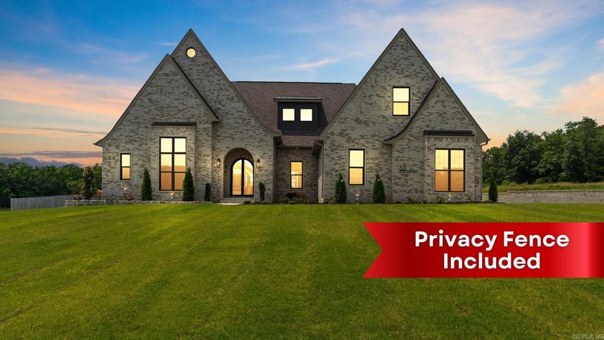 Introducing another exceptional Jim Atkinson Construction build, this stunning home is nestled on a generous 0.68-acre lot in the coveted Highland Hills of Springhill. This meticulously crafted residence boasts a modern and functional open and split floor plan, offering ample space for comfortable living. Featuring four spacious bedrooms, three conveniently located on the main floor and one upstairs, this home is perfect for families or guests. The upper level also includes a full bath and a magnificent bonus room, ideal for recreation or entertainment. The gourmet kitchen is a chef's dream, equipped with a central island, a breakfast bar, a utensil drawer, a spice rack, and a pot filler for added convenience. The pantry provides plentiful storage with drawers and is even wired for an ice maker. A charming coffee bar is another thoughtful addition. Each bedroom is complemented by full walk in closets in every bedroom, providing abundant storage space, while walk-in closets are a luxurious feature found throughout the home. The impressive entrance is highlighted by a massive black iron door setting the stage.