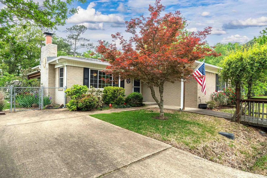 Here is some bang for your buck...2 lots, 1 house, 1 shop, a boat dock & ramp.  You will love this updated 2 bedroom home sitting on a half acre level lot.  It's so peaceful. The kitchen has new cabinets with stainless appliances.  There is an extra  living space that could easily be used as a third bedroom.  The great room is large with a wood stove fireplace to heat the house on cold winter nights.  The boat dock and ramp will make for easy boating during the summer months.  There is also a 24x30 shop with a concrete floor to store you toys.  There is even a carport to cover your camper.  Call today for a showing.