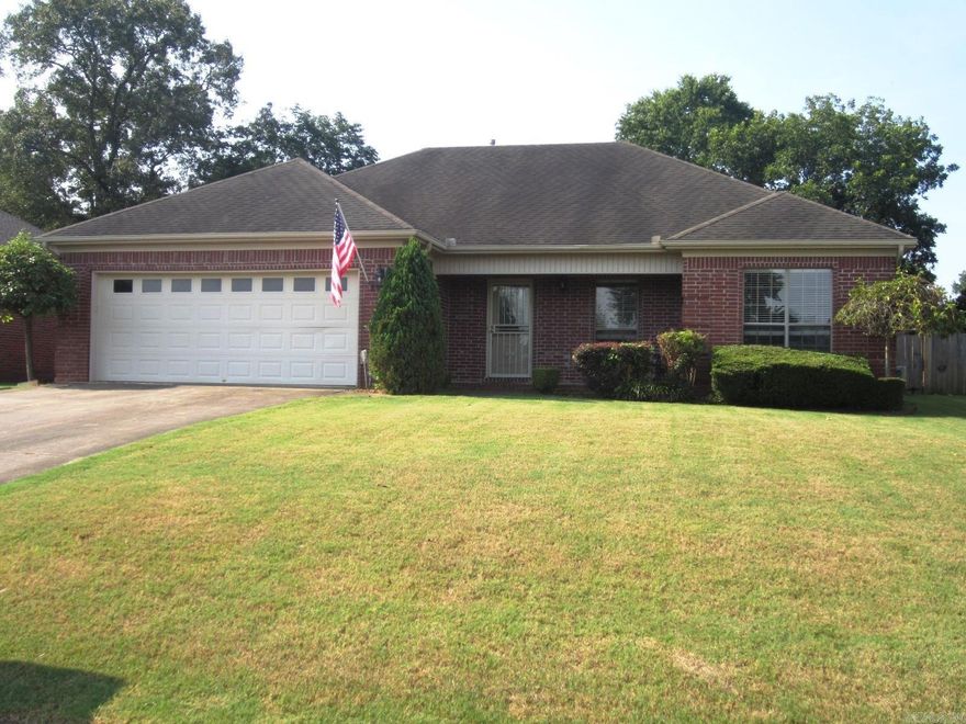 This amazing all brick 3 bedroom, 2 bath home with 1627 sq ft has a bonus room perfect for an office or craft room or even an extra bedroom. It has fresh paint, new floors & is clean and ready for a new family. The Living room has a warm gas log fireplace and a tray ceiling. For the chef, the kitchen has a gas range, breakfast bar and pantry. The matching refrigerator is negotiable. The primary suite has tray ceiling and it's bath has a walk-in shower, a jetted tub  and double vanity. There is a Large covered patio in back and a fully fenced back yard. I am told that the electric bills are about $25.00 per month because of the solar panels that will be paid off and convey to the new buyer at closing. You cannot see them from the front to preserve the nice curb appeal. This house is shipshape right down to the brick mailbox.