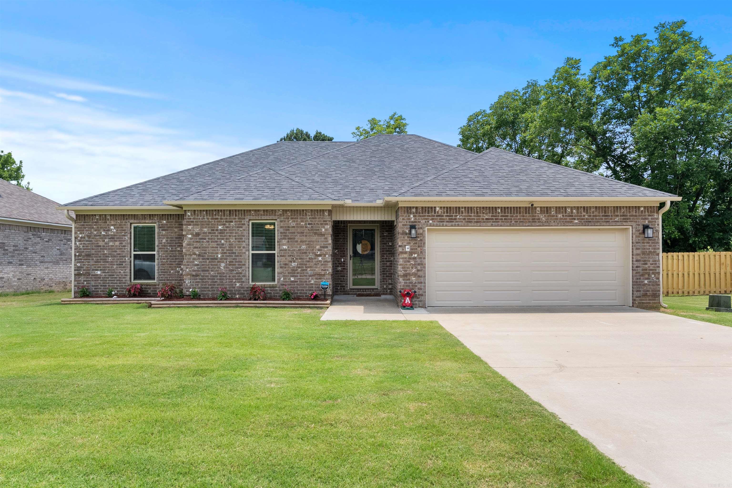 This could be the perfect entertainment home for you and your family. This home is on a level, fenced in oversized lot with two storage buildings, covered hot tub and extended patio. This brick home features modern amenities such as an awesome solar panel set up, free from contracts and grandfathered in at 1:1 capture. The two car garage features plenty of room and EV plug for ev auto's. The four bedroom home offers room for guests or optional office for remote work. Extra tall ceiling in the entertaining areas as well as under cabinet lighting in the expansive kitchen. Security is provided by the conveying security cameras installed. The floors are adorned by luxury vinyl planks providing a beautiful finished feel to the whole home. New gutters, downspouts, and flower beds adorn the front of the home to enhance your curb appeal building instant equity. You will love the Primary bedroom set up with modern tiled shower. Set up an appointment to view this wonderful home centrally located in Vilonia Schools. You will not be disappointed with this purchase.