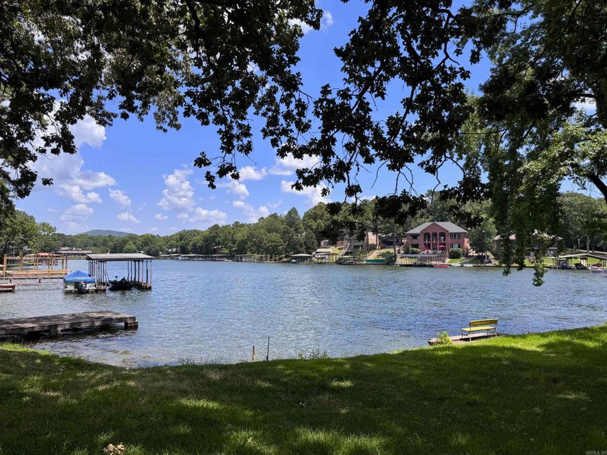 2 Cottages on Lake Hamilton! This Property features 111 feet of Lake Frontage with a Seawall and Swim Platform. The Main Cottage was built in 1968 and offers 2 Bedrooms, 2 Bathrooms and a Wonderful Deck overlooking the Lake. The Guest House Cottage is 1 Bedroom, 1 Bathroom and is Situated Near the Water. The Wall of Windows overlooking the Lake have Wonderful Views! It also has a Nice Workshop under the Cottage. This Property is one lot away from the Main Channel and the Cove is Wide - making it Perfect for Floating, Swimming, Kayaking, etc. All Offers are Subject to Court Approval. This Property is Selling As-Is, Where-Is. With a little imagination, this property could be a Darling Lake Retreat for your family! If you are in the market for a Lake Hamilton property within minutes of Shopping, Dining and ALL Things Hot Springs - don't miss it! Located Outside City Limits, this property can also be used for Nightly Rental and a Short Term Rental License is Not Required.