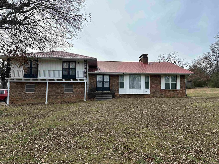 Beautiful 5 bedroom split floor plan home that sits back off the road with 35 acres around it.