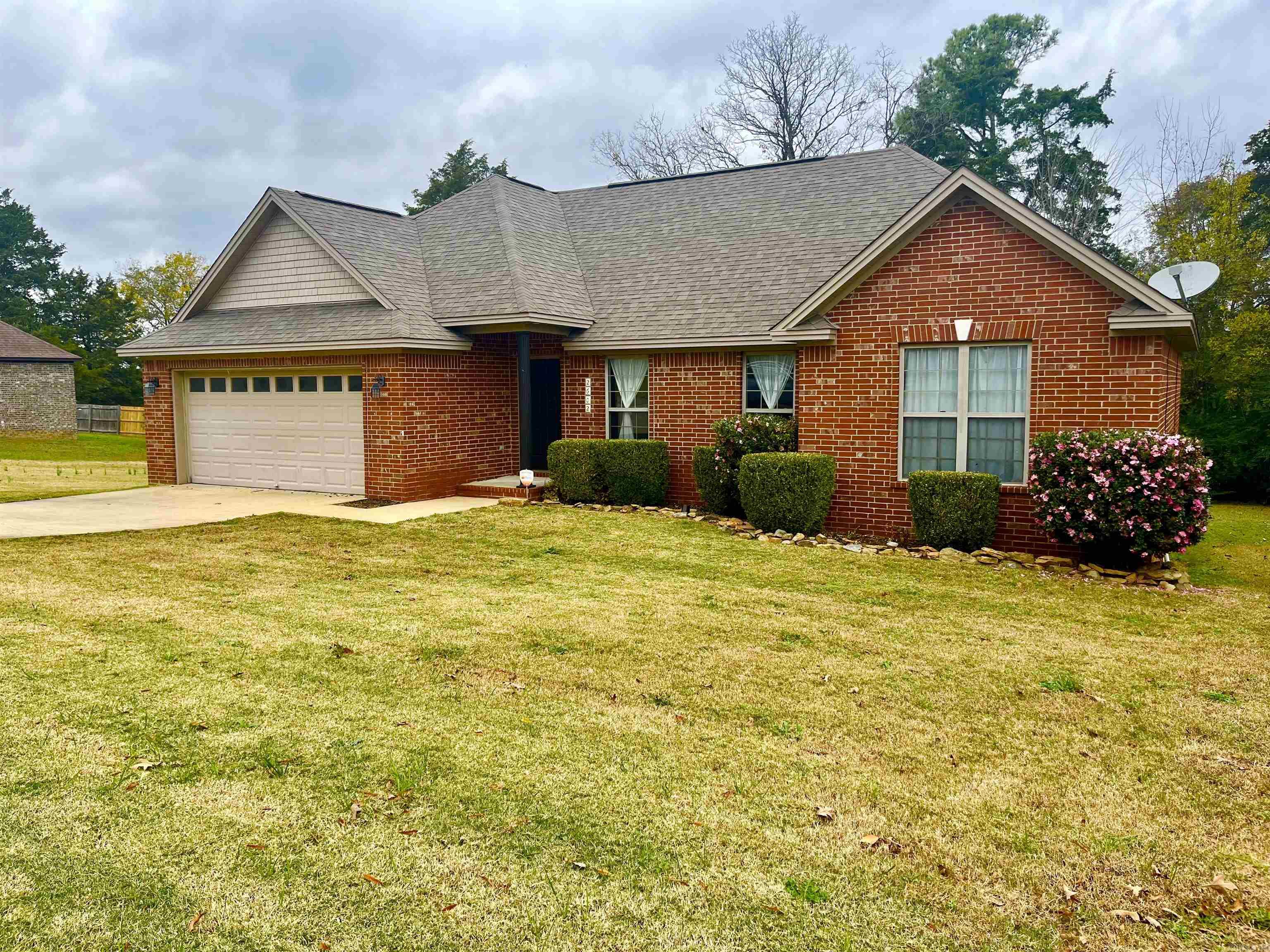 Welcome to the desirable Ridgewood Subdivision! This home has been meticulously maintained and features one year old beautiful luxury plank floors in the living room, carpet in the bedrooms and painted. The living room boasts of large windows, and tray ceilings. You will love the black granite countertops, beautiful solid cabinets, and a nice open dining room area! Walk into the large master bedroom with tray ceilings, two walk in closets, with a large master bathroom that has a separate walk in shower from the bathtub. You will like that the this is a split floor plan, so the other bedrooms are on the other side of the house for privacy! Just imagine coming home from a hard day at work and sitting on the back deck! This house is just minutes from Westside Elementary, 10 fitness, and The Country Club where you can enjoy playing golf, swimming, and having a nice dinner with your family and friends! This is a great neighborhood to walk, jog, and bike ride in!
