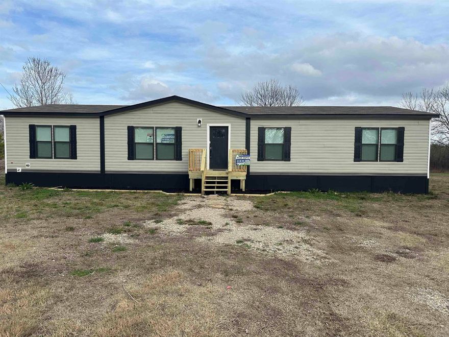 Beautiful, spacious 3 bedroom/2 bathroom with an office, large kitchen with island bar, pantry, huge laundry room (with pet wash station) on 6 acres! Refrigerator stays with property, survey and engineer report available.