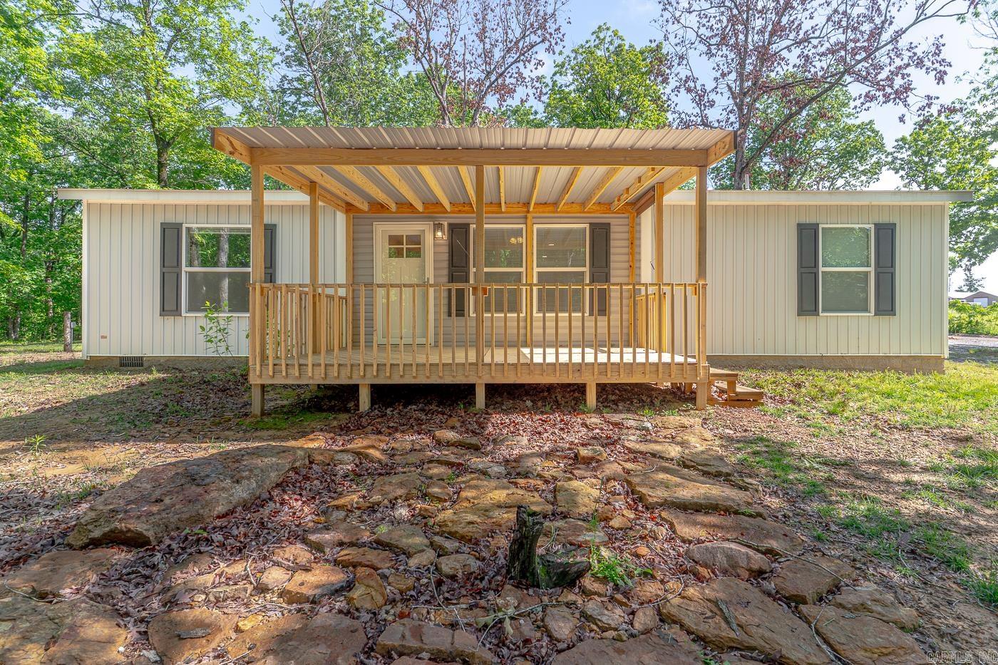 Welcome to Market 157 Futrell Rd in Mountain View, AR! This Beautiful 1,344 sq ft manufactured home has it all! From the front covered deck to the back wooden deck you can step out to see nature at its finest! Enjoy the 5.57 acres of nature. Per the Seller, foundation is tied down, making this gem eligible per FHA guidelines! Call your favorite agent today for your tour!