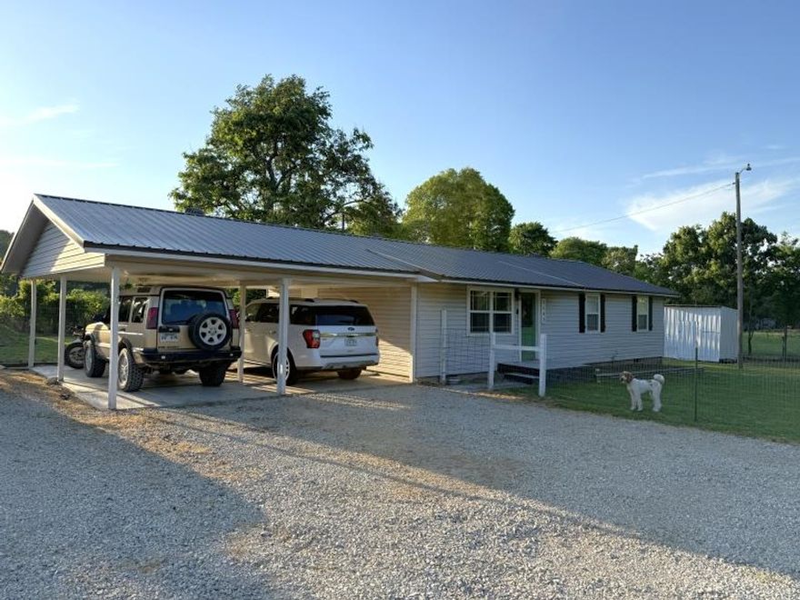 3 bedroom, 2 bath home on approximately 2.5 acres! All electric home, both bathrooms include a shower and tub, there is a large fenced in area around house, an outdoor shed, an attached carport, and a storm cellar! The acreage features a small pasture area with a pond and a chicken coupe.  The deck on the back was added recently. There is nothing not to love about this home and property!