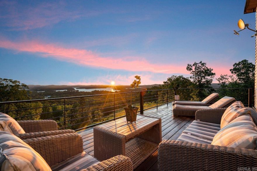 Fully furnished turn-key, high-end vacation rental with proven track record provided to qualified buyer(s). When you arrive at Moonlight Ridge & look upon the Ouachita Valley, you will be in awe of it's beauty! This vaulted mountain villa has unmatched views of Lake Hamilton & Hot Springs National Park from the hot tub & every room. The private 1 acre retreat will wow you w/ natural serenity, and offers ample space to add an additional dwelling. No STR permit required as it is located outside city limits. Though it is an exclusive mountain community with great privacy, our neighborhood is right off of Central Avenue. The main road that goes by Lake Hamilton, Oaklawn Casino and into Hot Springs National Park with an easy drive to Garvan Woodland Gardens and 2 Marians. We are close to everything. Check out the electric car charging station too.