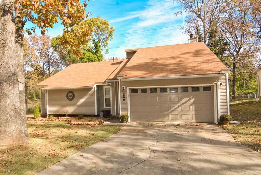 Indian Hills Elementary! Location is everything!!! House with 3 bedrooms, 2 baths, 2 car garage, fireplace, with a deck off the kitchen. Completely updated with new kitchen cabinets, countertops and appliances. New windows, new flooring and a storage building in the back. Walk-in closet in master. Located in a beautiful neighborhood.