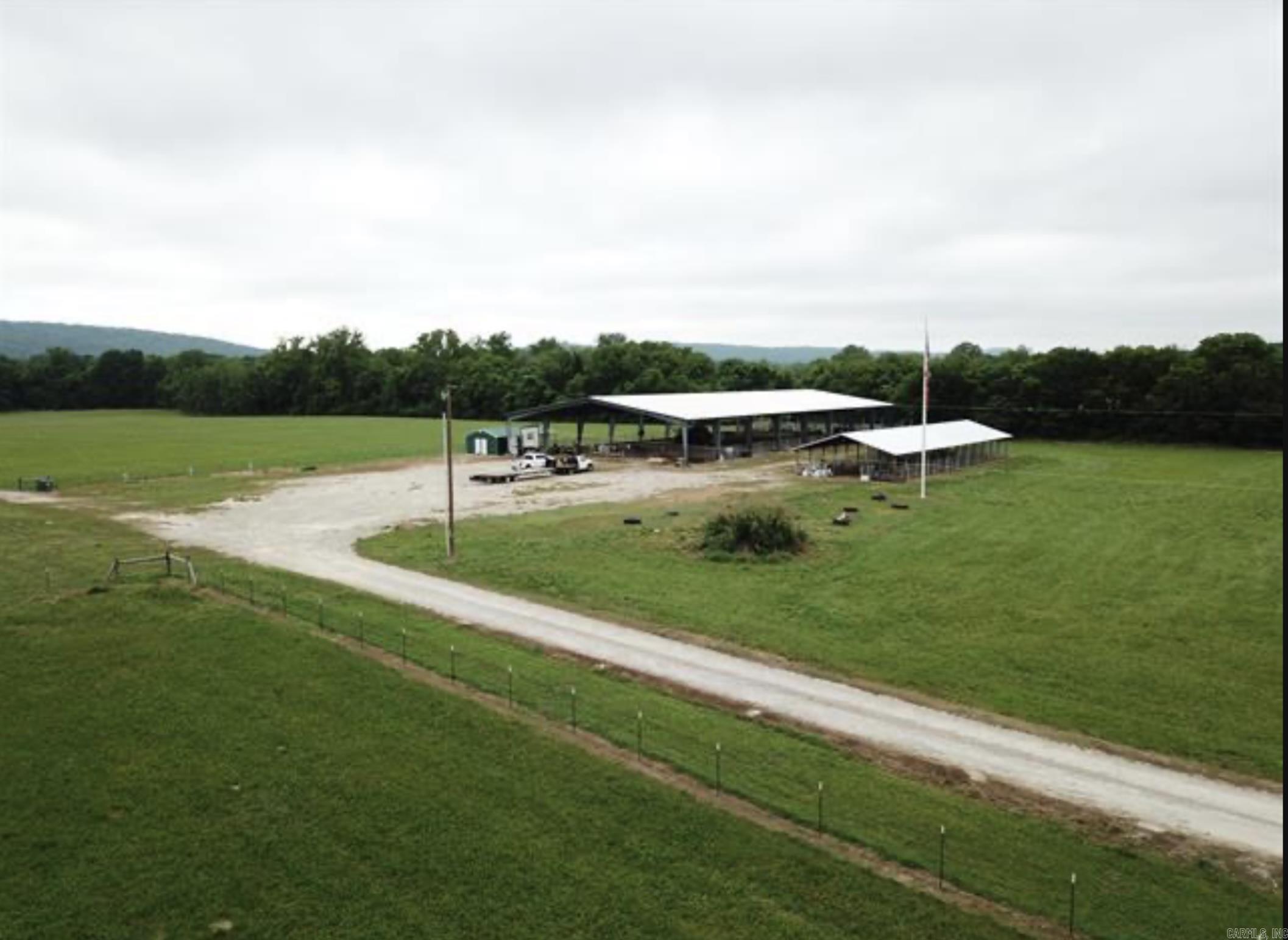 Absolutely Horseman/cattlemen Dream, working farm with 100x200 Covered Arena LED Lighting, sound system has had numerous events competitive sports, Team Penning, Barrel Racing/pole bending two outside bathrooms with concession stand. 4 holding pens. Next to Arena is a 24 stall covered horse barn, with lighting dust to dawn, water. Don't forget about the 18 RV Spots with 30/50 AMP AND WATER FOR. Second barn has 9 enclosed stalls plus a wash bay, machine shop office. Round pen with more stalls. 8 separate fenced pastures 3 additional hay pastures, 3 Ritchie watering systems, Third Barn for Hay. Over 1/2 mile Highway Frontage/3/4 mile of River frontage.