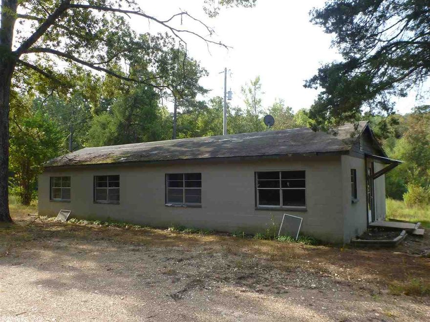 Beautiful acreage with a pond just steps away from a small house/shop. Has a Kitchen and bathroom in it. Could be the perfect place to stay while you build your new home. Property has hills and valleys and creeks that run through it. Great place to have all the family nearby and still give lots of privacy. Road already cut in through the property. 24 minutes to Little Rock. Utilities available!