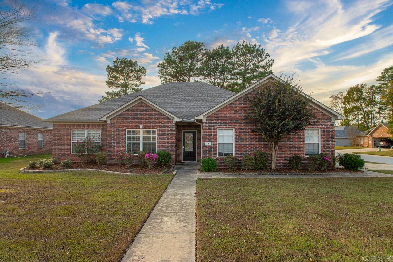 Welcome home! Beautiful 3 bed 2 bath brick home on a corner lot! Large licing area with fireplace. Kitchen/dining combo with updated appliances, beautiful cabinetry, and a breakfast bar. Master bedroom features tray ceiling, his & her sinks, his & her closets, jetted tub, and a shower. Large guest bedrooms. Laundry room. Fenced in backyard with a covered back patio. This home is move in ready, schedule your showing today!