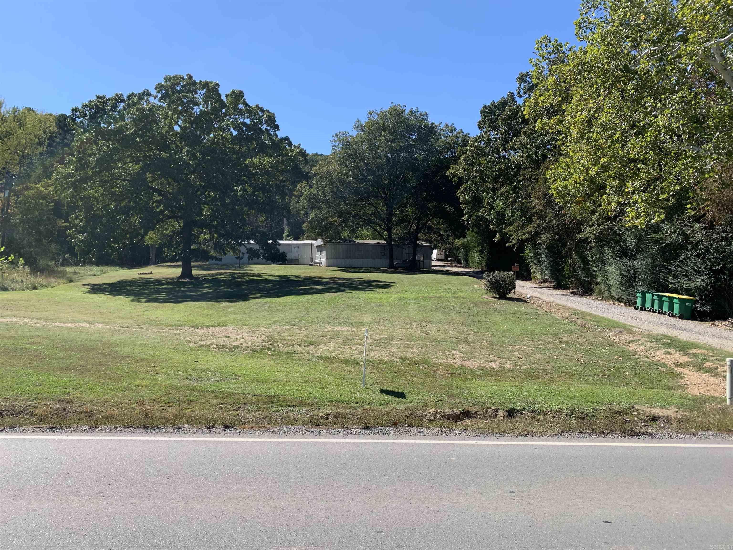This beautiful 1.82 acre site includes 5 Mobile Homes and a small attached apartment that currently rent for $3,585.00 per month.