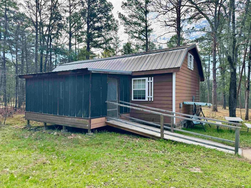 Escape to the beauty of the Ozarks with this charming 1 bedroom, 1 bathroom cabin with a loft, nestled on 4.42 acres near the White River. Whether you're looking for the perfect fishing retreat, weekend getaway, or a cozy full-time residence, this property offers endless possibilities. Inside, the cabin features an open floor plan with tall wood ceilings that create a warm, spacious feel. Step outside to enjoy the screened-in front porch, perfect for relaxing mornings. The property also includes a storage building and an additional lot with a drilled well (no pump), adding extra value and potential. With room to roam and a peaceful setting just minutes from the river, this is your chance to own a slice of Ozark paradise.