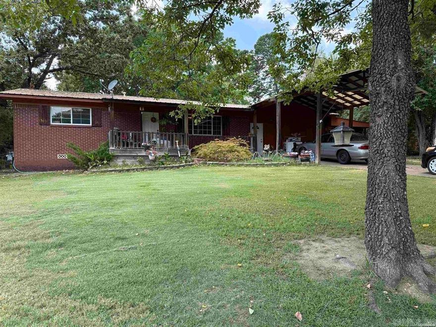 Larger home on beautiful lot close to everything! Several updates in past 5 years including flooring, gorgeous skylight in kitchen, crown molding, newer double pane windows. The master suite has a wonderful dressing room area and newer shower.  Sunroom looks out over the back yard where you find a storage building with utilities and a fully fenced back yard. There is a lean-to shed to store all your yard supplies. Fruit trees are everywhere including pear, peach and fig! Sunroom is not included in courthouse square footage but is heated and cooled! Washer, dryer and fridge in shed convey along with window a/c unit in shop. gray storage building does not convey. There is a chimney in sunroom if you wanted a wood or pellet stove!