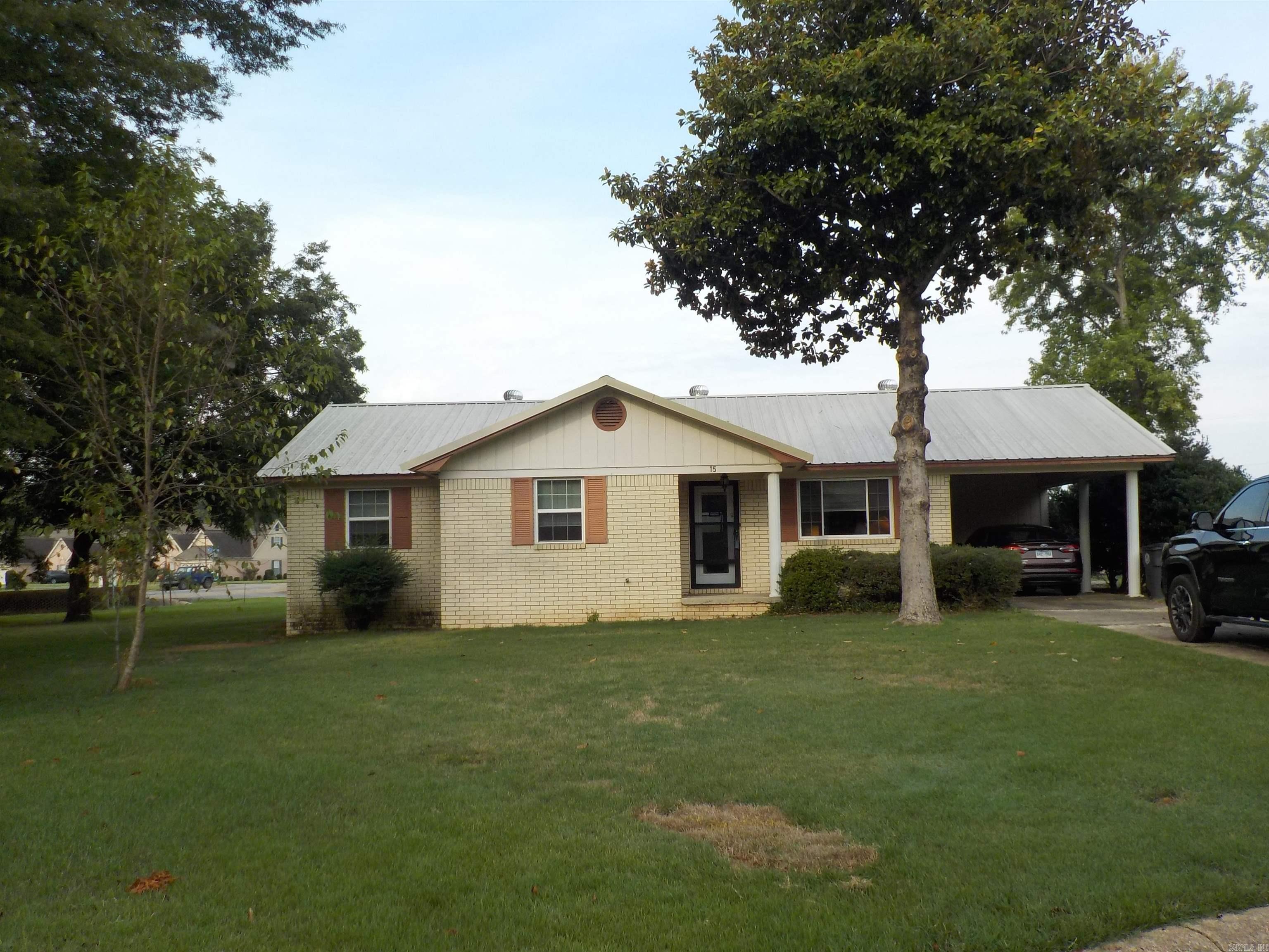 Very well maintained brick home with updates to include, new windows, newer HVAC system, beautiful walk in shower in master bath, metal roof, stainless range and dishwasher, wood look flooring in living room and hallway. Large laundry room. Sunroom added, 2 storage buildings, partial fenced back yard. Yard is larger and backs up to Searcy Church of Christ parking lot. Great convenient location to shops and restaurants.
