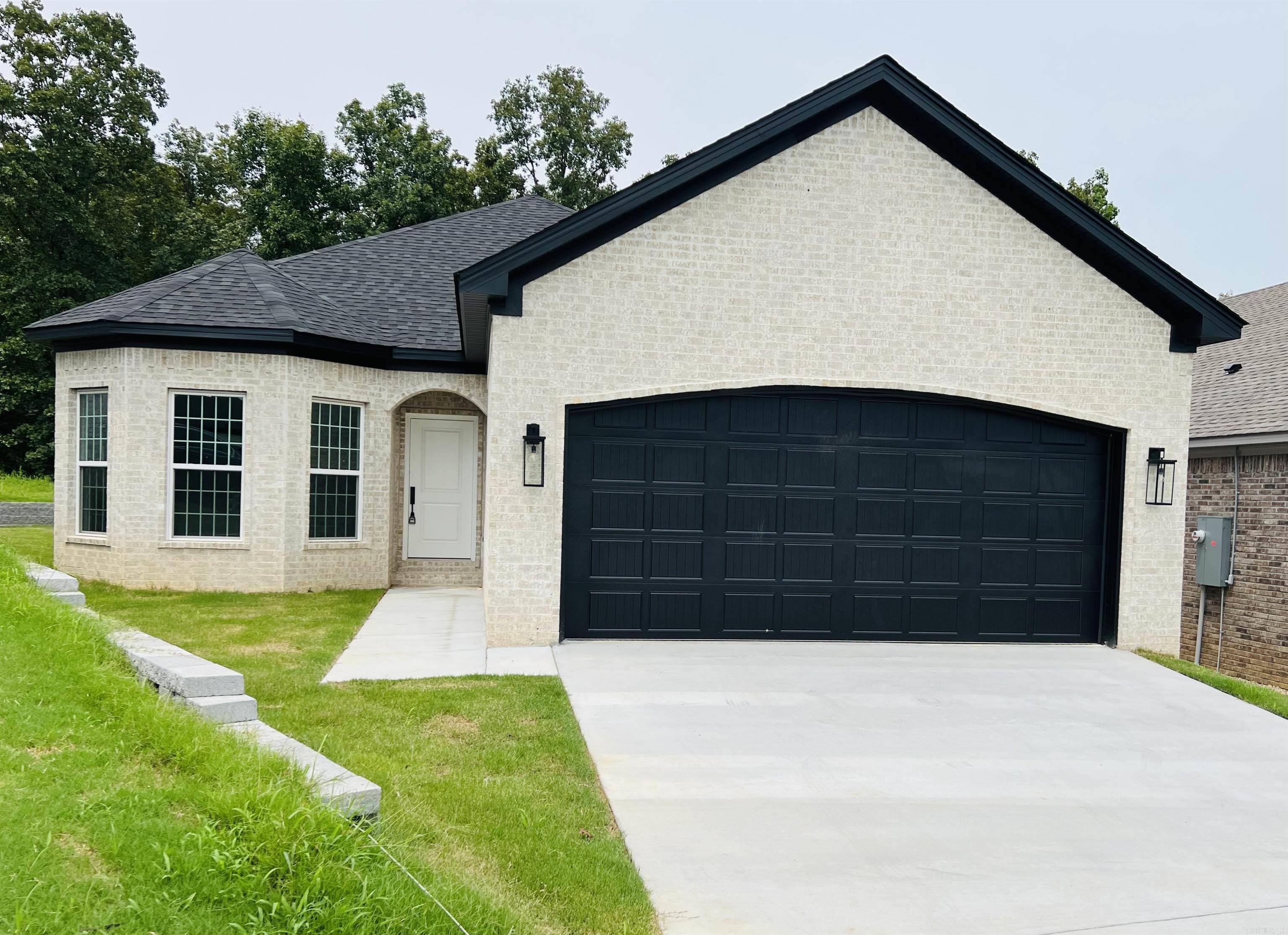 Affordable New Construction in Sherwood. This home is beautifully built with attention to detail. Covered porch in the front and covered patio in the back. All brick for easy maintenance. 9'-10' Ceilings throughout. Granite counter tops. Granite Waterfall Island in the kitchen. Stainless Steel appliances. Crown molding throughout the home. Windows capped and trimmed. Walk-in master closet. Hardwood floors in living room, kitchen, and dining area. All electric for easy maintenance. Estimated Completion date of 5/15