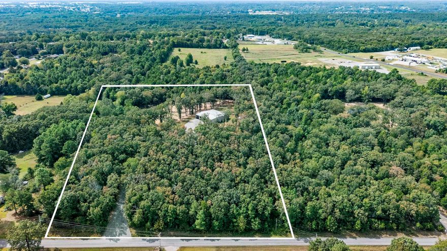 Work here, play here, live here! This one-of-a-kind barndominium sits on 12.77 acres just minutes from the city limits of Searcy offering approximately 1920 sq ft of H/C living space, 4800 sq ft of insulated H/C shop space.This red-iron building perfectly blends, comfort and function. Inside its all about the details-crown molding, custom cabinetry, wall ovens built-in grill,  spa-style shower. Outdoors, you'll find an in-ground pool, fenced yard and an 8 x 12 storage building with electric. Perfect for downsizing or retirement living, with space to expand if desired. Private and peaceful setting close to everything.