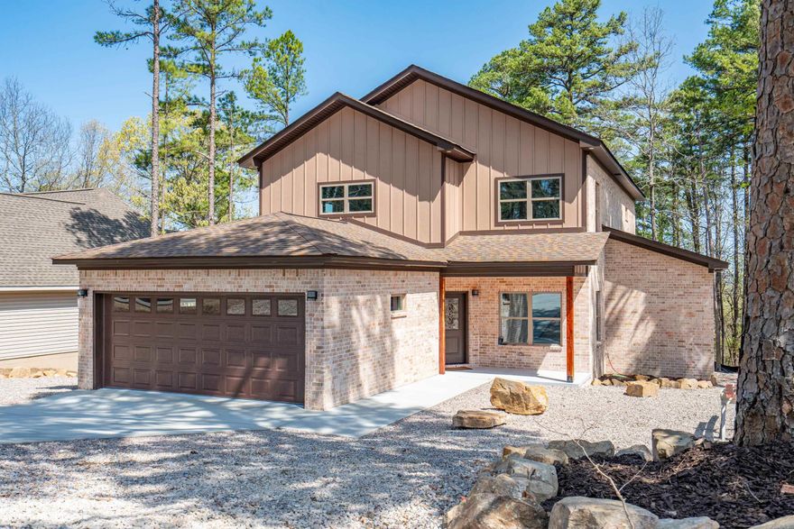 This newly built home offers modern elegance and unbeatable convenience in the heart of Hot Springs Village! This stunning 4-bedroom, 3-1/2 bath home, plus  awesome Media Room (upper level) and office room (main level) is bathed in natural light and showcasing all the latest finishes. The gourmet kitchen is a chef’s dream, featuring quartz countertops with a large area for seating, stainless steel appliances, and custom cabinetry.  Walk-in pantry and large laundry room! The expansive living area is perfect for entertaining, while the cozy dining space adds charm for family meals. The primary bedroom is a luxurious retreat, complete with a reading room, spa-like ensuite bathroom, a walk-in shower, and a generously sized walk-in closet. Additionally, the private enclosed deck is designed to put your own Spa or seating area. Three more bedrooms upstairs provide flexibility for children, guests, and hobbies. Outside, there is plenty of potential for landscaping with 2 patio decks for outdoor living. This unbeatable location near West Gate, provides convenient access to shopping, dining, golf courses, & all that HSV has to offer!