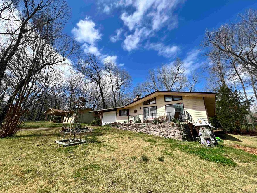 This meticulously maintained two-bedroom, two-bathroom residence is a true gem, boasting a host of recent upgrades and charming features throughout. Situated just half a mile from the tranquil South Fork River and the prestigious north golf course, this property offers the perfect blend of convenience and natural beauty. Step inside to discover a spacious interior with vaulted ceilings and an inviting ambiance. The cozy wood-burning insert fireplace sets the stage for cozy evenings spent relaxing with loved ones. Outside, you'll find your own private oasis. The front patio features a picturesque Koi pond surrounded by a beautiful garden area, creating a serene retreat to enjoy your morning coffee or unwind after a long day. In the backyard, a patio awaits, complete with a raised garden bed and plenty of extra storage space in the additional storage buildings. Recent upgrades including a new architectural shingle roof, hot water heater, and septic tank ensure peace of mind for years to come. Whether you're seeking a peaceful retreat or a place to entertain friends and family, this home offers the perfect combination of comfort, convenience, and charm!