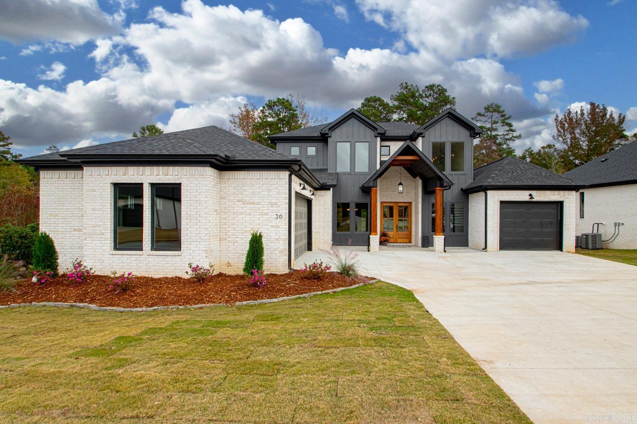 This recently completed new construction home is found in an upscale subdivision in Chenal Valley. In addition it is a nice corner lot that backs up to greenspace. Lots of natural lighting is found in this main level open concept floorplan. The kitchen includes a large pantry, a gas cooktop with pot filler, double ovens and microwave. The large master suite, located on the main level, includes a large walk in closet, double vanities, and a large walk through shower. Guest room on main level has ensuite bathroom. Located upstairs are 2 bedrooms each with private bath, one has additional sitting area or bonus area. A flex space is also found upstairs for office, gym, or media room.