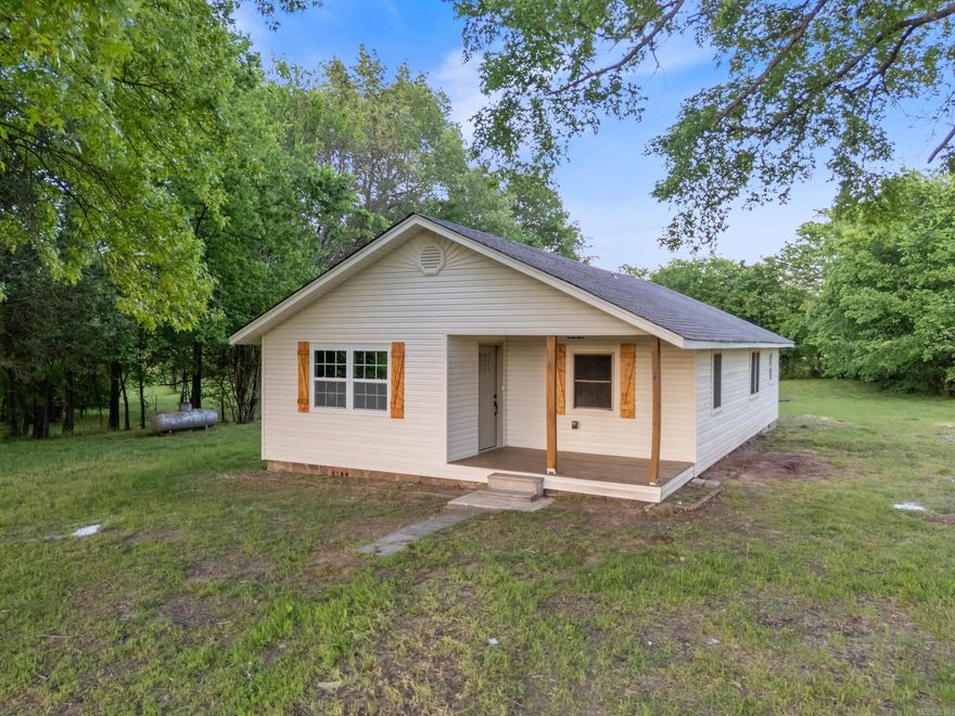 Have you been looking for the perfect country home, but all the ones you find need tons of updates?  Look no further, this is it! Beautiful country setting with a home that has been completely renovated!  The only things not new on this home are the exterior walls, footings, and windows.  Everything else is new!  Enjoy watching the sunset over the distant Ouachita Mountains from the inviting front porch.  The home is surrounded by pastures and views of the rolling hills of the Ouachitas. Inside, you'll find an open floor plan with a living room that flows seamlessly into the kitchen. Granite countertops throughout this home. All new luxury vinyl floors, new paint, new fixtures, new doors, you get the idea! Importantly, the roof with architectural shingles is new as well.  This could save you on money on insurance costs. Outside storage building that, with a little TLC, could be great for storage or a shop. This country home feels far away, but is less than 10 minutes to schools, shopping, and restaurants in the beautiful Ouachita Mountain community of Danville.  Don't wait, schedule your private showing today!