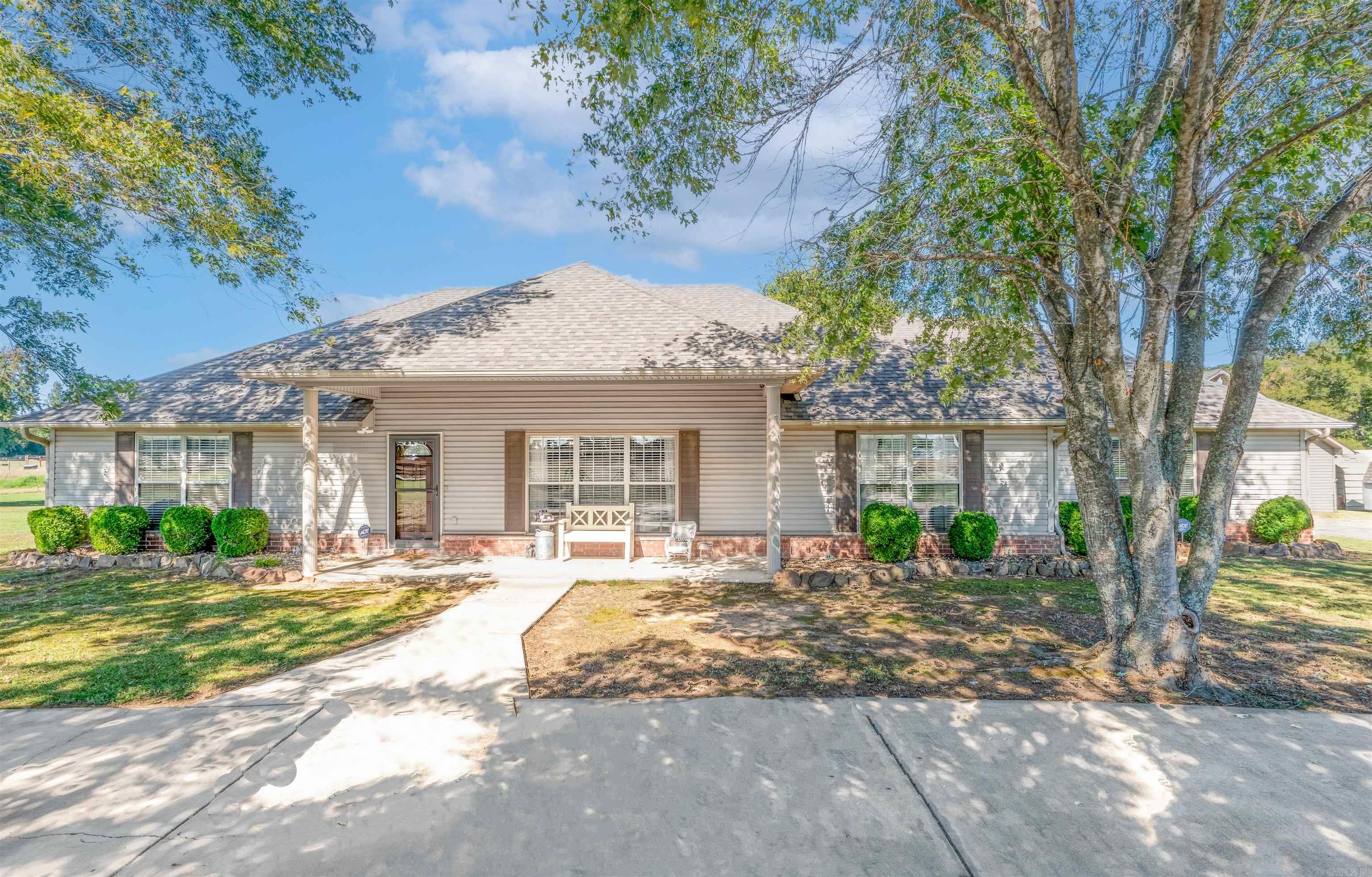 Welcome to this 4-bedroom, 3 full bath home sitting on 9.05 peaceful acres in Vilonia Schools! Built in 2004, this property has so much to offer. Youāll love the spacious bedrooms, including a guest ensuite with its own full bath and private entranceāperfect for in-laws or visitors. The enclosed back porch is perfect for quiet mornings, additional entertainment space or even and office or work out room. Outside you will find multiple ponds stocked with fish as well as a 30x40 shop with electricity that could double as a detached garage. The property is fully fenced with a gated driveway, storm shelter (2006), and plenty of space for kids, pets, or animals. Updates include a 2023 roof, one-year-old appliances including a double oven with convection and air fryer features.  2020 outdoor HVAC, and 2024 indoor unit. Cool off in the 33ā above-ground pool with a brand-new 2025 pump, and take advantage of three outbuildings plus two metal awnings for storage, additonal parking or equipment. Country living at its bestāmove-in ready and full of charm!