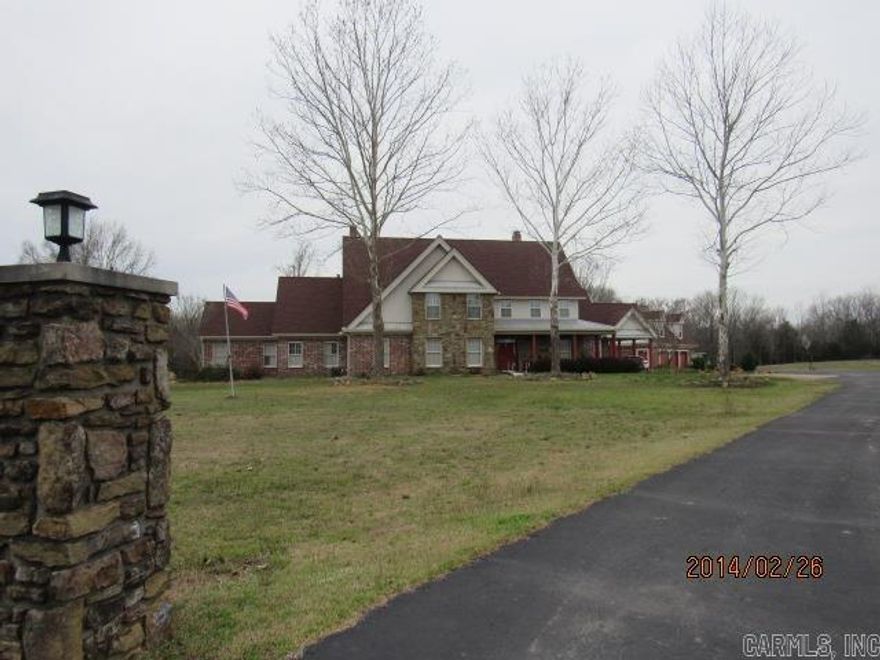 Absolutely Beautiful!!! Home on 14.77 acres with a stocked pond and a large dock to kick back and fish! Grand Entrance into the open formal dining & great room with 26' wood timber ceiling and native stone fireplace. Chef's dream kitchen large bar and island, top of the line appliances, custom refrigerator and fireplace. Oversized primary suite with sitting area, fireplace, private on suite bath with jacuzzi tub, steam shower, separate vanity areas and large walk in closet. Detached 3 car garage/shop/ living quarters, adds an extra 810 s.f. of living space above the 1418 s.f. of garage/shop space.